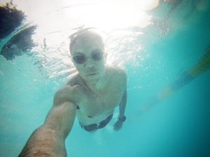 Tony swimming in the pool